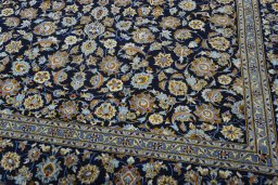 Close-up detail of 2000s Kashan rug from Iran / Persia showing Wool weave