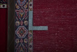 Close-up detail of 2000s Kashan rug from Iran / Persia showing Wool weave