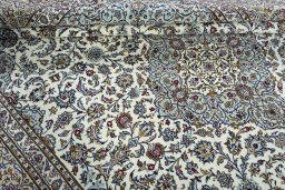 Close-up detail of 2000s Kashan rug from Iran / Persia showing Wool weave