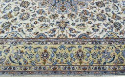 Corner detail of 1970s Kashan rug showing border pattern and Wool pile