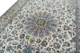 Backside of handmade 1970s Kashan rug showing knot structure and weave density