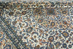Close-up detail of 2000s Kashan rug from Iran / Persia showing Wool weave