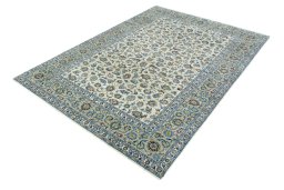 Corner detail of 2000s Kashan rug showing border pattern and Wool pile