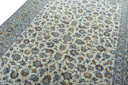 Backside of handmade 2000s Kashan rug showing knot structure and weave density