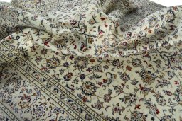 Surface texture of 2000s Kashan rug with natural Wool and intricate pattern