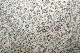 Close-up detail of 2000s Kashan rug from Iran / Persia showing Wool weave