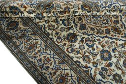 Close-up detail of 2000s Kashan rug from Iran / Persia showing Wool weave