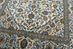 Close-up detail of 2000s Kashan rug from Iran / Persia showing Wool weave