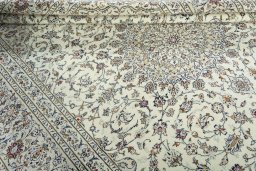 Close-up detail of 2000s Kashan rug from Iran / Persia showing Wool weave