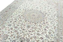 Backside of handmade 2000s Kashan rug showing knot structure and weave density