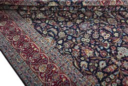 Close-up detail of 2000s Kashan rug from Iran / Persia showing Wool weave