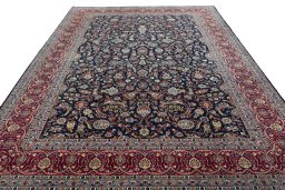 Surface texture of 2000s Kashan rug with natural Wool and intricate pattern