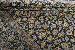 Close-up detail of 2000s Kashan rug from Iran / Persia showing Wool weave