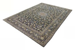 Corner detail of 2000s Kashan rug showing border pattern and Wool pile
