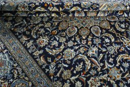 Close-up detail of 2000s Kashan rug from Iran / Persia showing Wool weave