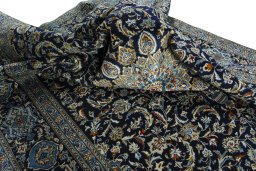 Surface texture of 2000s Kashan rug with natural Wool and intricate pattern