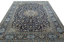 Surface texture of 2000s Kashan rug with natural Wool and intricate pattern