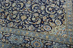Close-up detail of 2000s Kashan rug from Iran / Persia showing Wool weave