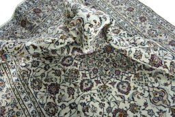 Surface texture of 2000s Kashan rug with natural Wool and intricate pattern