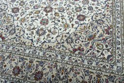 Close-up detail of 2000s Kashan rug from Iran / Persia showing Wool weave