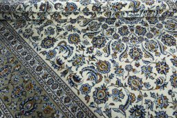 Close-up detail of 2000s Kashan rug from Iran / Persia showing Wool weave