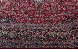 Corner detail of 1950s Kashan rug showing border pattern and Wool pile