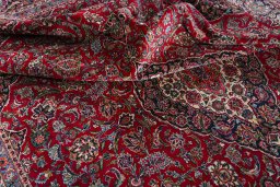 Surface texture of 1950s Kashan rug with natural Wool and intricate pattern