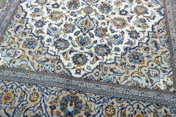 Close-up detail of 2000s Kashan rug from Iran / Persia showing Wool weave