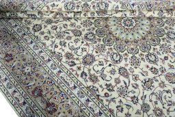 Close-up detail of 2000s Kashan rug from Iran / Persia showing Wool weave