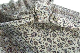 Surface texture of 2000s Kashan rug with natural Wool and intricate pattern