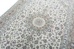Backside of handmade 2000s Kashan rug showing knot structure and weave density