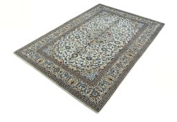 Corner detail of 2000s Kashan rug showing border pattern and Wool pile