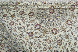 Close-up detail of 2000s Kashan rug from Iran / Persia showing Wool weave