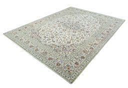 Corner detail of 2000s Kashan rug showing border pattern and Wool pile