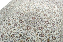 Backside of handmade 2000s Kashan rug showing knot structure and weave density