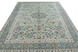 Surface texture of 2000s Kashan rug with natural Wool and intricate pattern