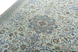 Backside of handmade 2000s Kashan rug showing knot structure and weave density