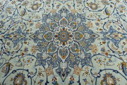 Central medallion detail of 2000s Kashan rug from Iran / Persia
