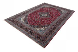 Corner detail of 2000s Kashan rug showing border pattern and Wool pile