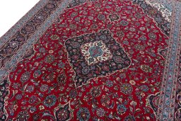 Backside of handmade 2000s Kashan rug showing knot structure and weave density