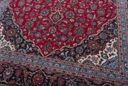 Close-up detail of 2000s Kashan rug from Iran / Persia showing Wool weave