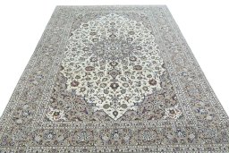 Surface texture of 2000s Kashan rug with natural Wool and intricate pattern