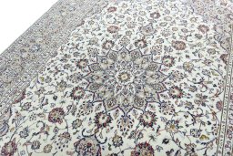 Backside of handmade 2000s Kashan rug showing knot structure and weave density