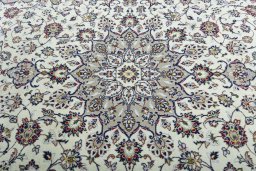 Central medallion detail of 2000s Kashan rug from Iran / Persia