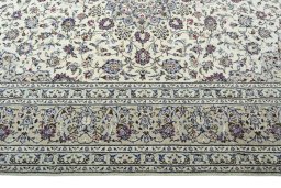 Corner detail of 2000s Kashan rug showing border pattern and Wool pile