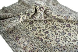 Surface texture of 2000s Kashan rug with natural Wool and intricate pattern