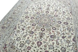 Backside of handmade 2000s Kashan rug showing knot structure and weave density