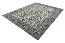 Corner detail of 2000s Kashan rug showing border pattern and Wool pile