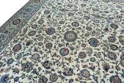 Backside of handmade 2000s Kashan rug showing knot structure and weave density