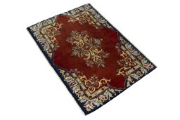 Corner detail of New Kashan rug showing border pattern and Wool pile